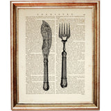 Black-and-white illustration of an antique-style knife and fork with decorative handles on a vintage dictionary page